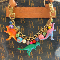 Lenora Dame dinosaur bag chain. Cute chain bag charm for handbag with dinosaurs and colorful beads.