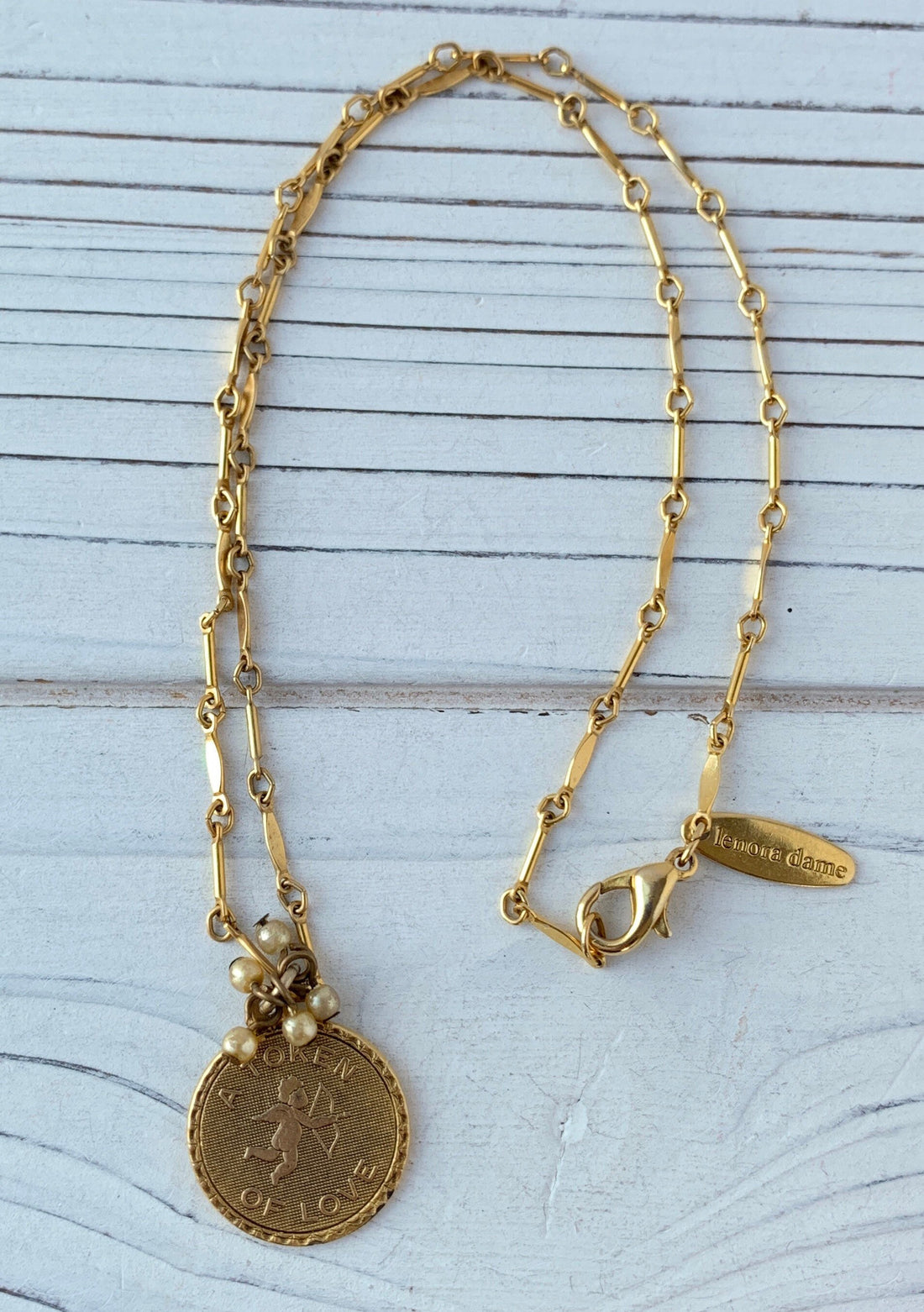 Gold Token of Love charm necklace. Cupid pendant necklace. Valentines gift for her.