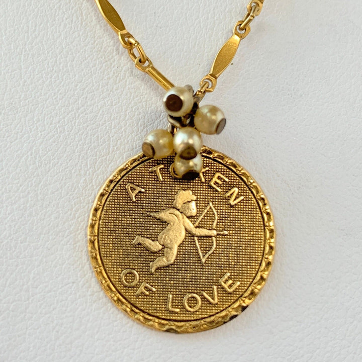 Gold Token of Love charm necklace. Cupid pendant necklace. Valentines gift for her.