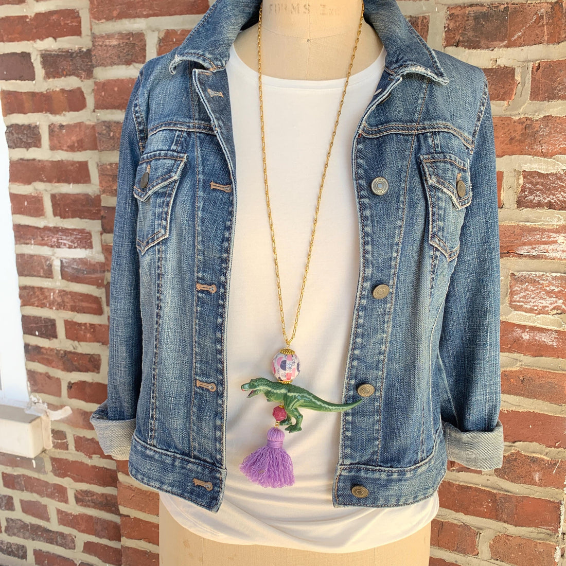 Tyrannosaurus Rex pendant necklace for women. Dinosaur charm necklace on a gold chain.