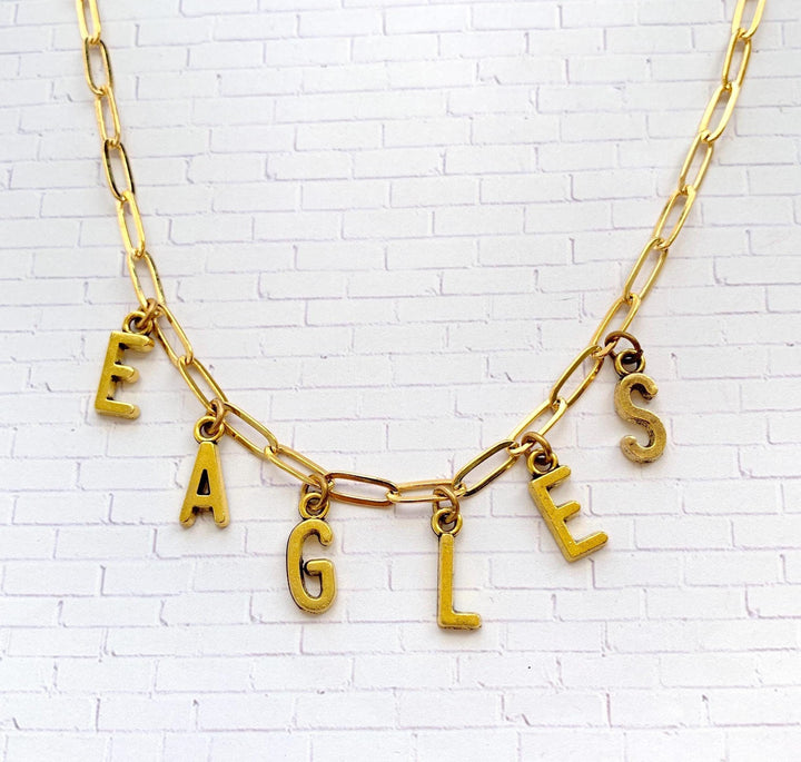Philadelphia Eagles necklace. Gold paper clip chain necklace with letter charms that spell eagles.