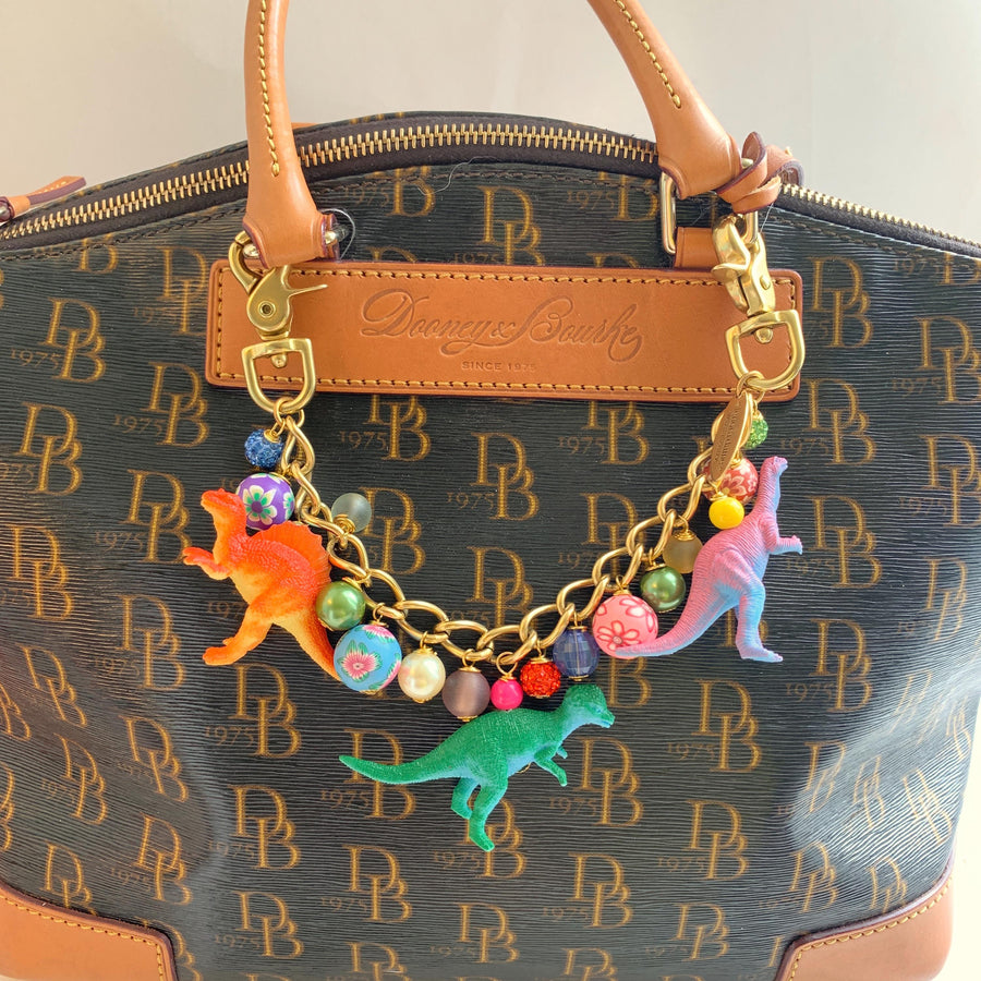 Lenora Dame dinosaur bag chain. Cute bag chain for handbag with dinosaurs and colorful beads.