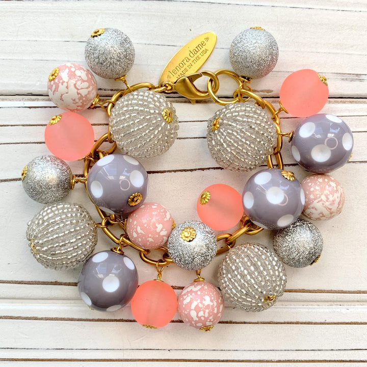Lenora Dame chunky bracelet with pink, peach, grey and silver beads on a gold chain.