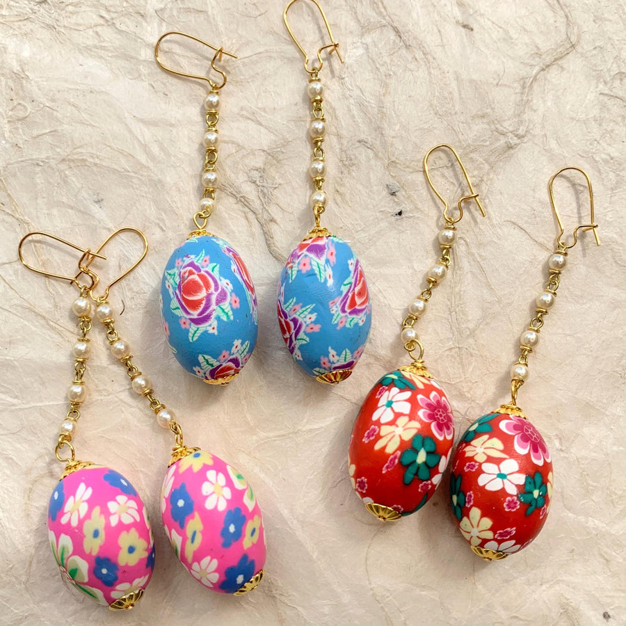 Lenora Dame earrings. Lenora Dame Easter Egg Earrings. Cute earrings for spring. Floral egg shaped fimo beads, pearl chain dangle from French ear hooks. 